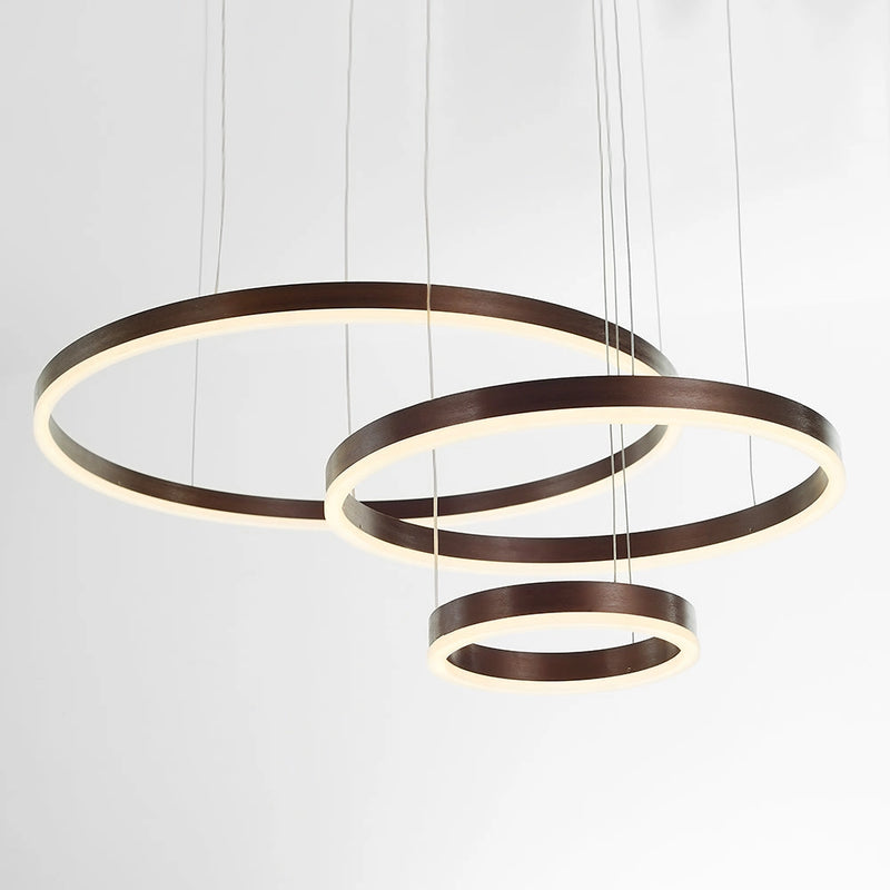 Circular LED Pendant Light with Gold Finish, Adjustable Height Chandelier, featuring a sleek circular design with a modern metal frame.