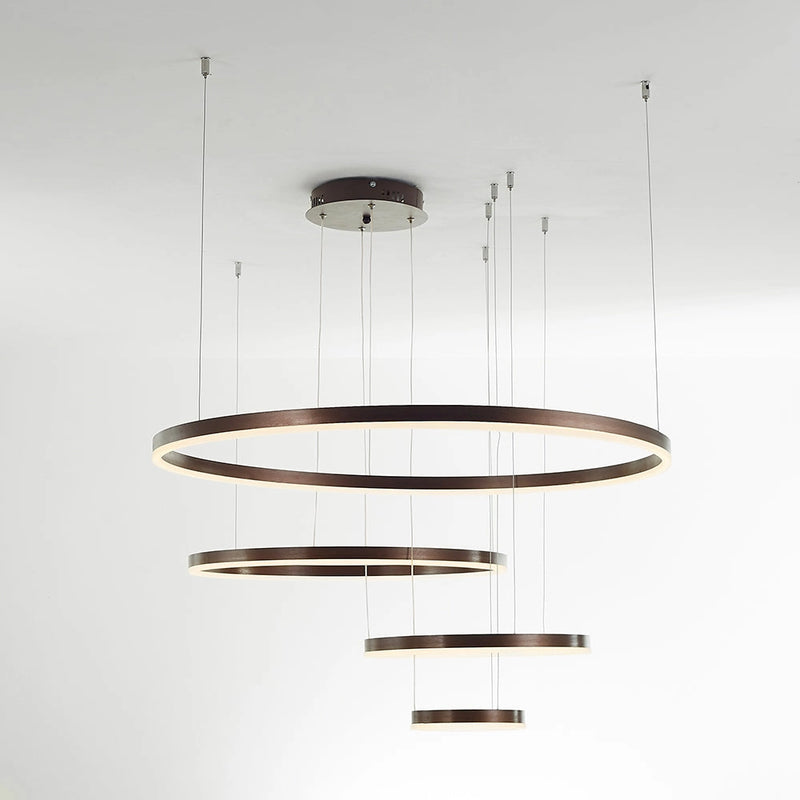 Modern Circular LED Pendant Light with Gold Finish and Adjustable Height, featuring a sleek cylindrical design, suspended from the ceiling.