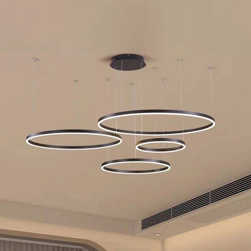 Modern Circular LED Pendant Light in gold finish with adjustable height, featuring four dimmable black rings in 40cm, 60cm, and 80cm sizes.