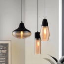 Designer Ribbed Glass Pendant Light with a modern industrial design, featuring a ribbed glass shade and wooden accents, ideal for kitchen interior lighting.