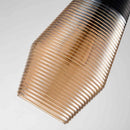 Modern industrial kitchen lamp featuring a ribbed glass pendant light with metal and wood accents, hanging from the ceiling.