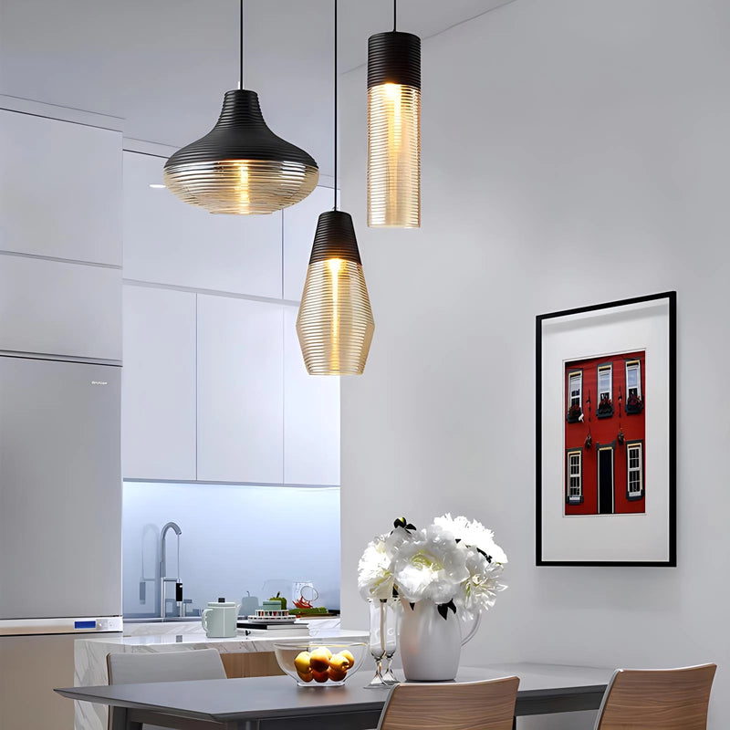 Modern industrial kitchen with a designer ribbed glass pendant light hanging above a wooden table, complemented by yellow and grey interior design elements.
