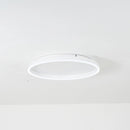 Minimalist black and white thin bangle bracelet with an elegant unisex design, displayed on a white porcelain surface.