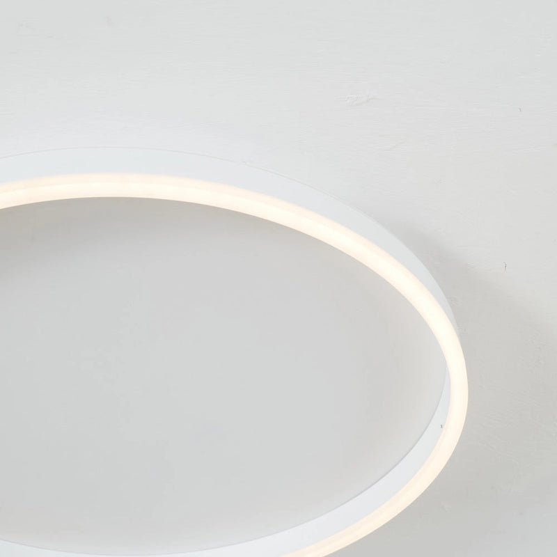 Minimalist black and white thin bangle bracelet with an elegant unisex design displayed on a white surface.