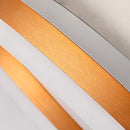 Minimalist black and white thin bangle bracelet with elegant unisex design placed on a wooden table background.