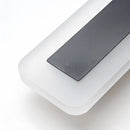 Minimalist LED wall sconce featuring a sleek vertical rectangular design with a modern aesthetic and electric blue illumination.