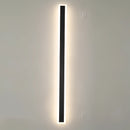 Minimalist LED Wall Sconce with a sleek vertical rectangular design, illuminated and mounted on a wall.