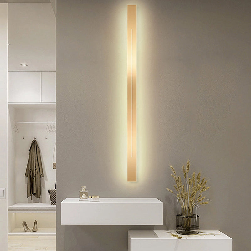 Minimalist slim gold bar pendant necklace on a white background, showcasing its modern vertical design.