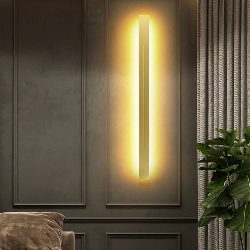 Minimalist slim gold bar pendant necklace with a modern vertical design, showcased against a wooden background.