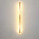 Minimalist Slim Gold Bar Pendant Necklace displayed on a wooden surface.