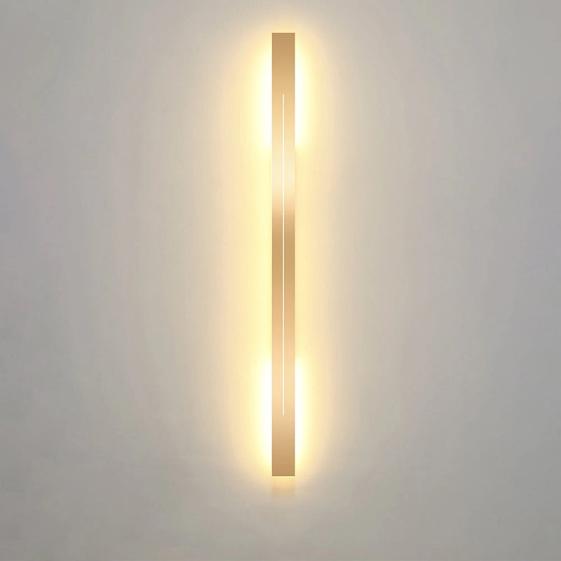 Minimalist Slim Gold Bar Pendant Necklace displayed on a wooden surface.