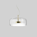 Modern glass pendant light with brass accents, 35CM clear dimmable ceiling fixture, hanging from a ceiling with a circular shape and elegant design.
