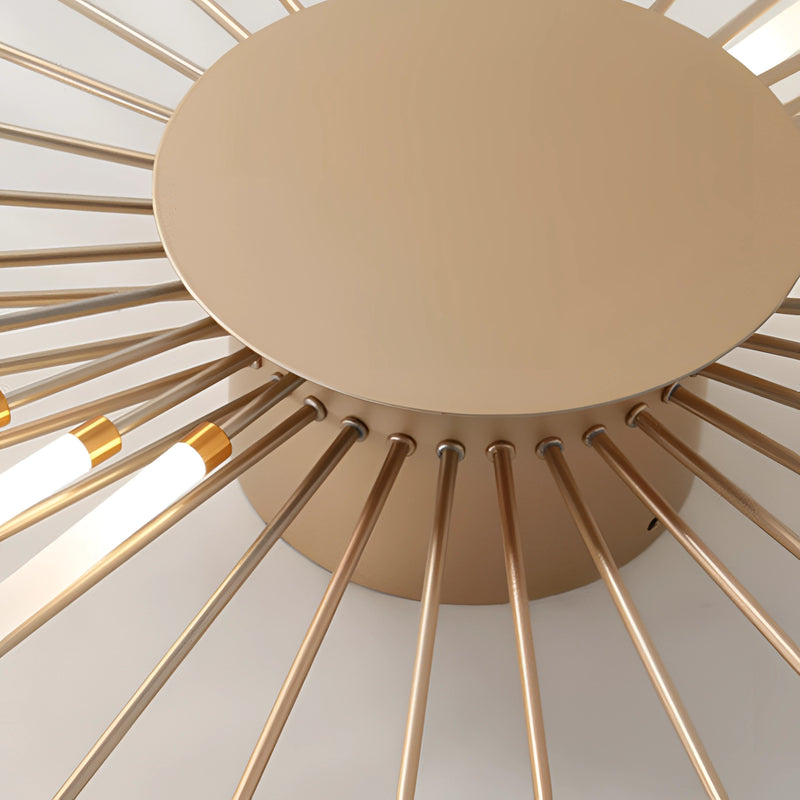 Modern starburst wall art featuring a mid-century black and gold metal sculpture with symmetrical circular design, displayed against a beige and brown wooden background.
