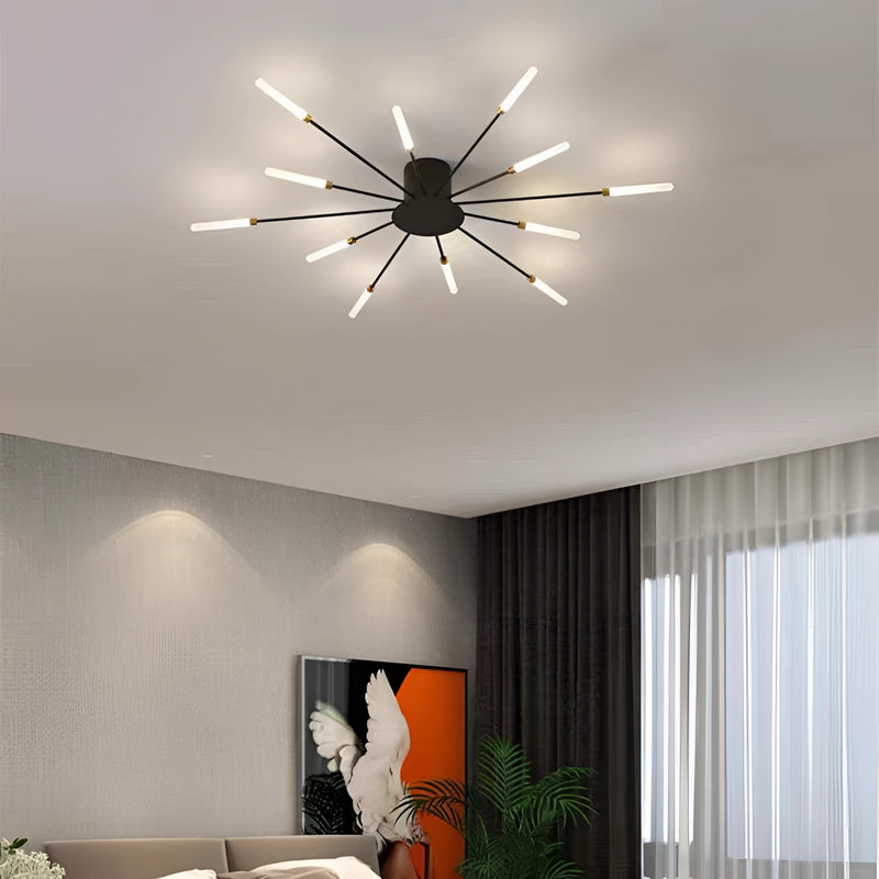 Modern starburst wall art sculpture in black and gold metal, displayed in a mid-century styled interior with wood accents, curtains, and indoor plants, featuring 12W dimmable lighting.