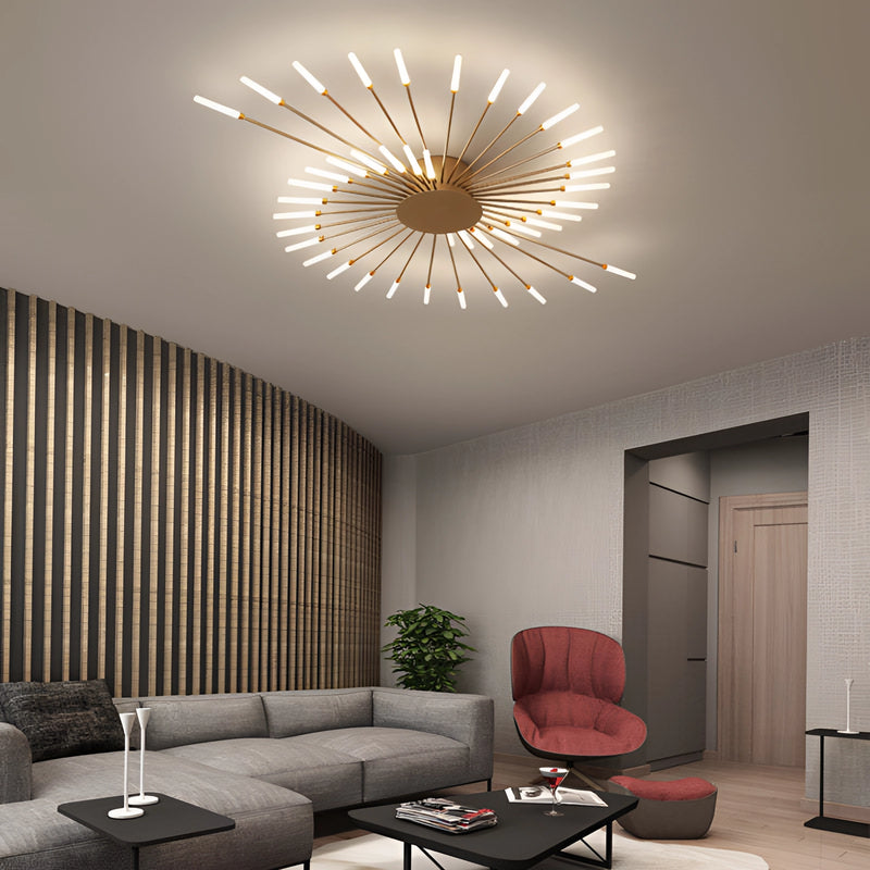 Modern Starburst Wall Art - Mid-Century Black Gold Metal Sculpture hanging on a wall above a comfortable couch in a well-designed living room with wooden flooring and modern lighting.