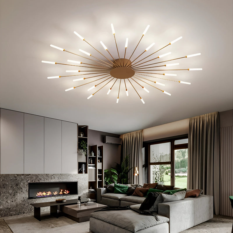 Modern Starburst Wall Art - Mid-Century Black Gold Metal Sculpture hanging on a wall in a stylish living room with a couch, table, and indoor plant; interior design featuring contemporary furniture and lighting.