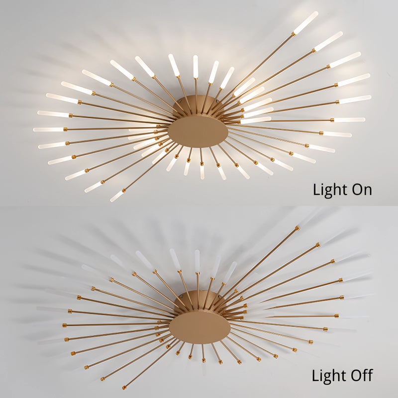 Modern starburst wall art in black and gold metal with geometric lines and symmetrical design.