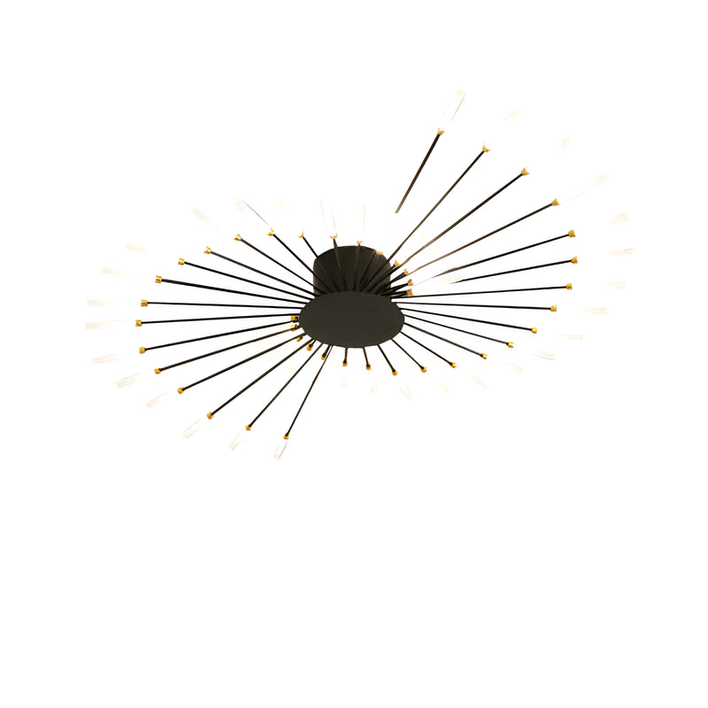 Modern starburst wall art with mid-century design in black and gold metal, featuring symmetrical circular patterns and intricate eye-like graphics.