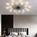 Modern starburst wall art sculpture with black and gold metal design, featuring a mid-century aesthetic; displayed in an interior setting with white and wooden elements, also showcasing a 20W dimmable diffuser.