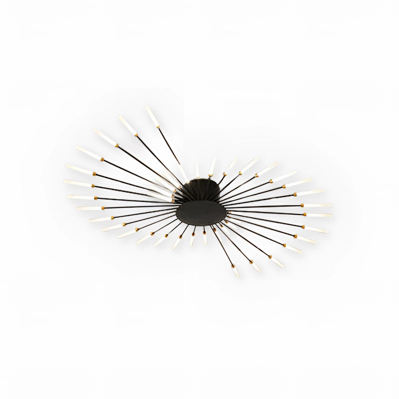 Modern Starburst Wall Art featuring a mid-century design with black and gold metal sculpture, showcasing symmetrical circular patterns.