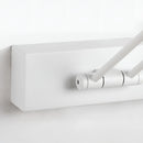 Sleek black dimmable LED picture light, cordless and adjustable, wall-mounted on a white surface.