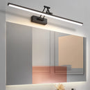 Sleek black dimmable LED picture light, cordless and adjustable, wall-mounted above a wooden frame, emitting cold light.