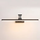 Sleek black dimmable LED picture light, wall-mounted above a wooden shelf with artwork, adjustable and cordless.