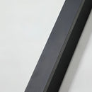 Minimalist Slim Vertical LED Wall Sconce mounted on a wall outdoors, showcasing its sleek rectangular design and waterproof features.