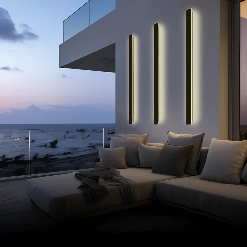 Minimalist waterproof slim vertical LED wall sconce illuminating a modern indoor space with stylish architecture and comfortable interior design.