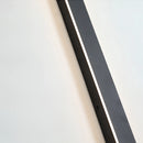 Slim Vertical LED Wall Sconce mounted on a modern exterior wall with a sleek, minimalist design featuring a rectangular shape and electric blue light.